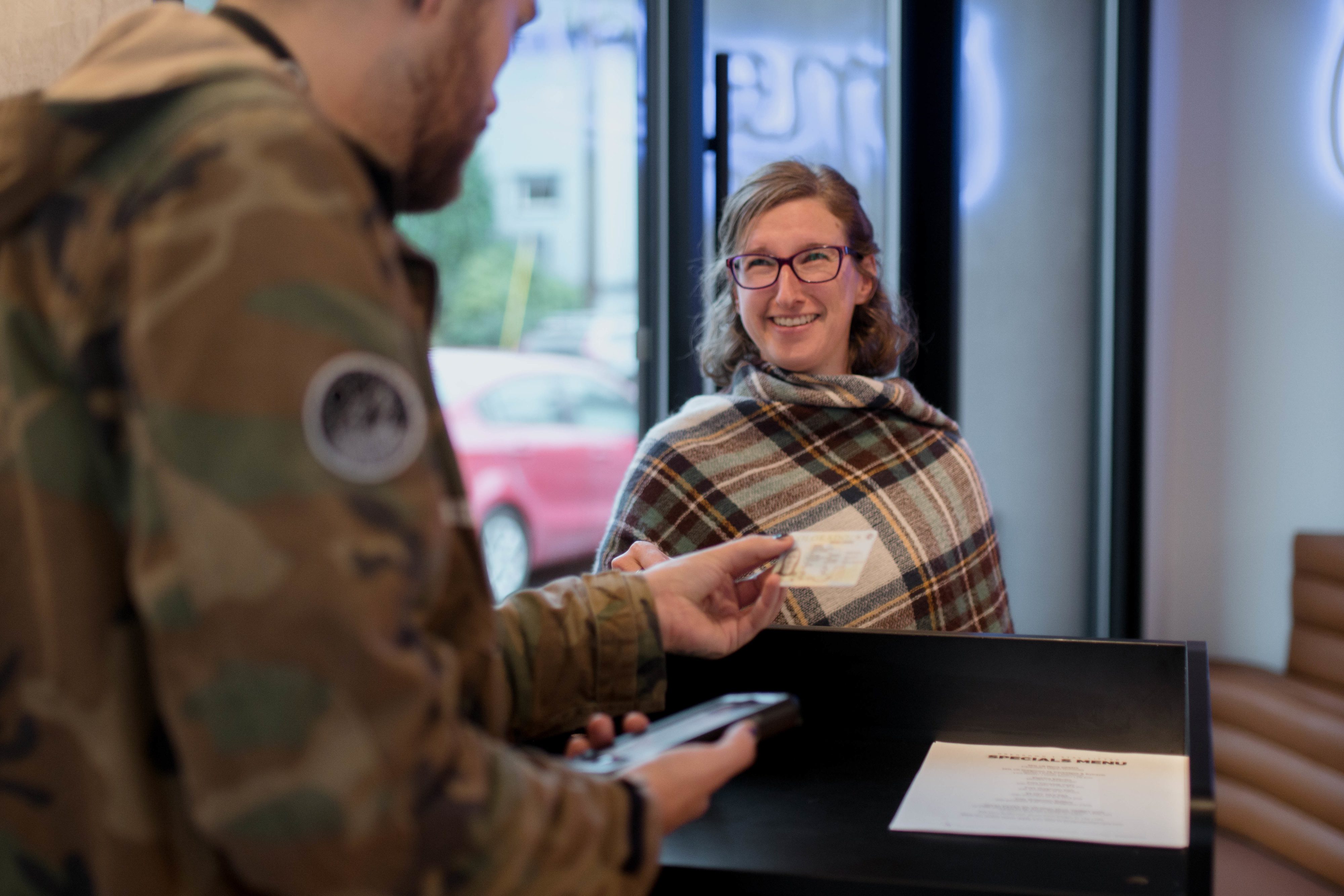 a customer checks in at a dispensary